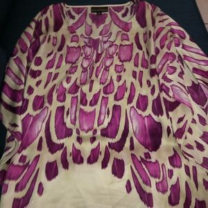 Going out shirt. Color is like beige with purple. Size: M